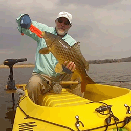 fly fishing for carp from a stading kayak