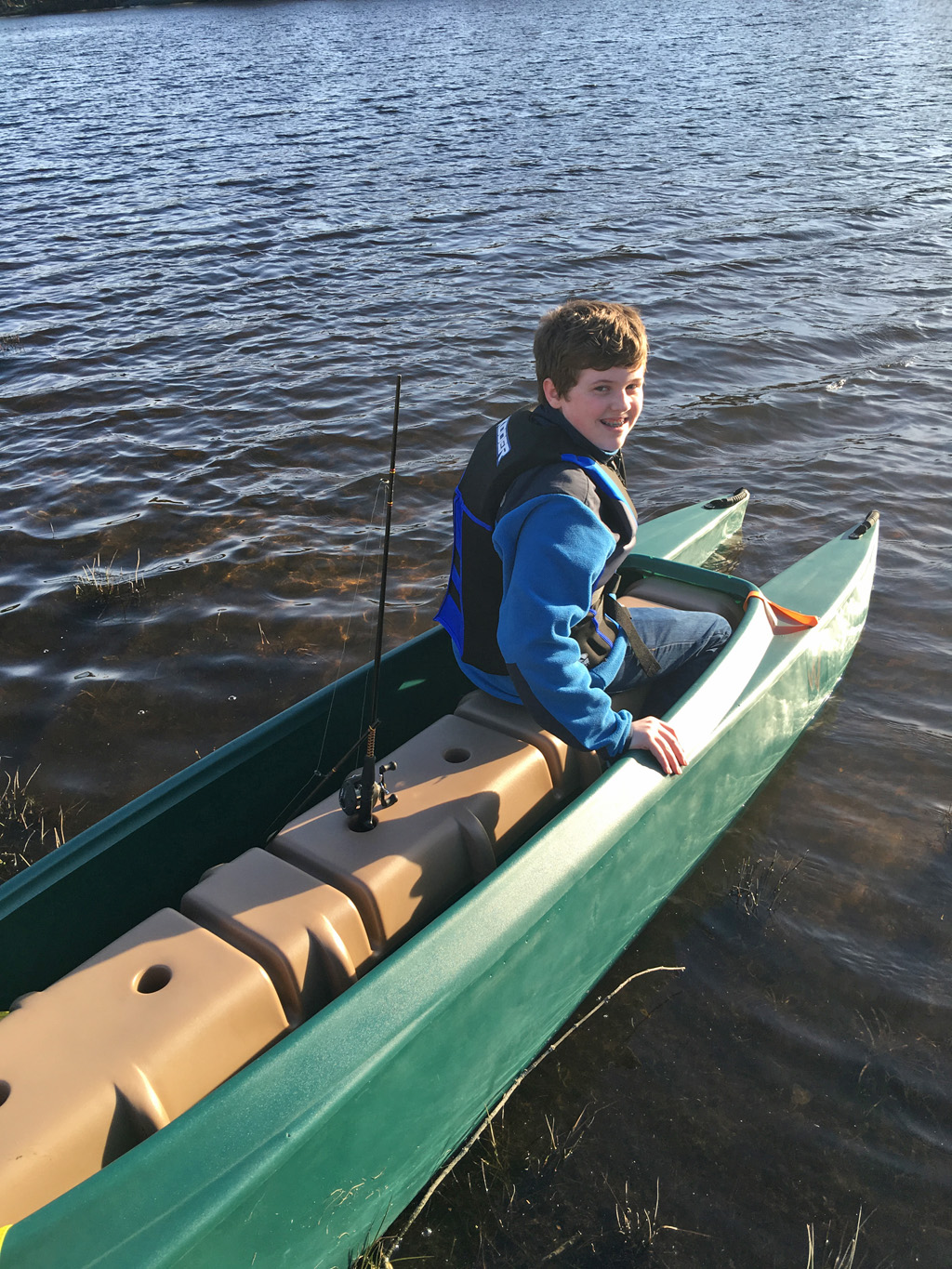 boy-sitting-in-the-front-of-a-W700-tandem-fishing-kayak