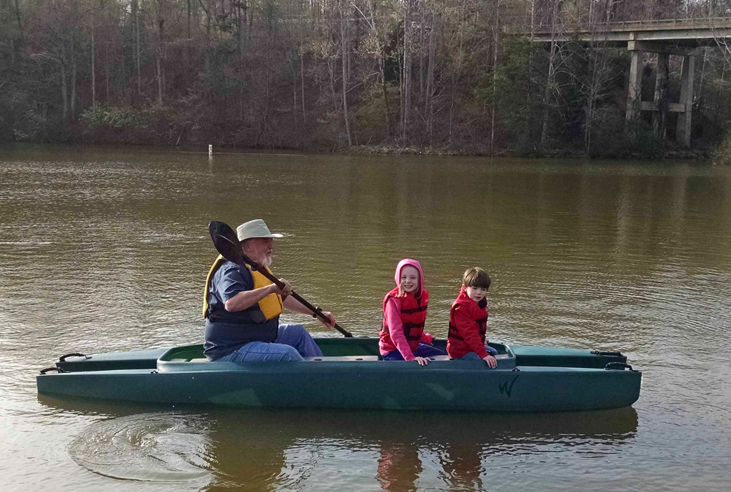 grandpa-paddling-fishing-kayak-with-two-grandchildren-on-board-56