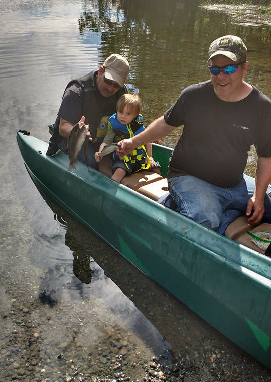 chris with adult and kid fishermen on board W700