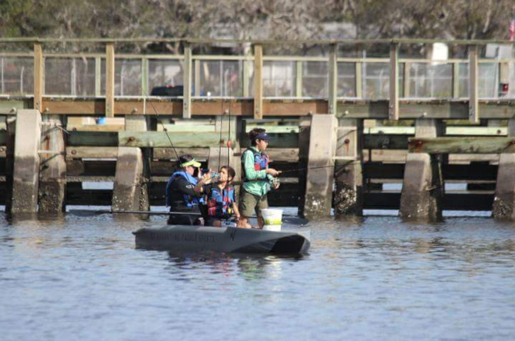 family fishing out of a Wavewalk S4 kayak