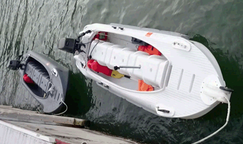 Two motorized kayaks racing against each other