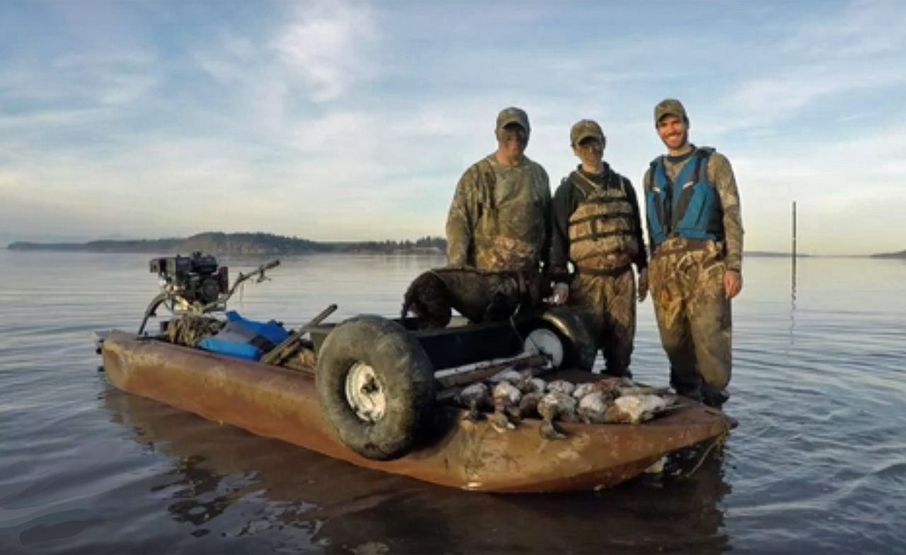 Mud motor mounted on a Wavewalk S4 duck hunting kayak