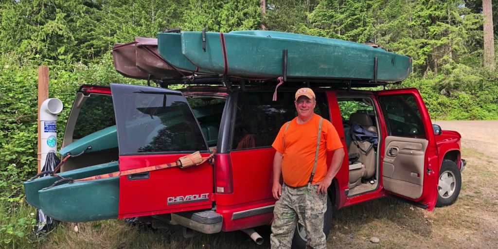 4 fishing kayaks transported in SUV