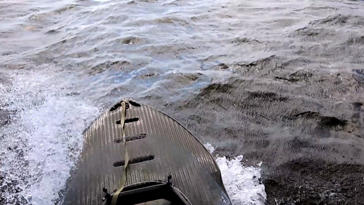 S4 motor kayak going in rough water