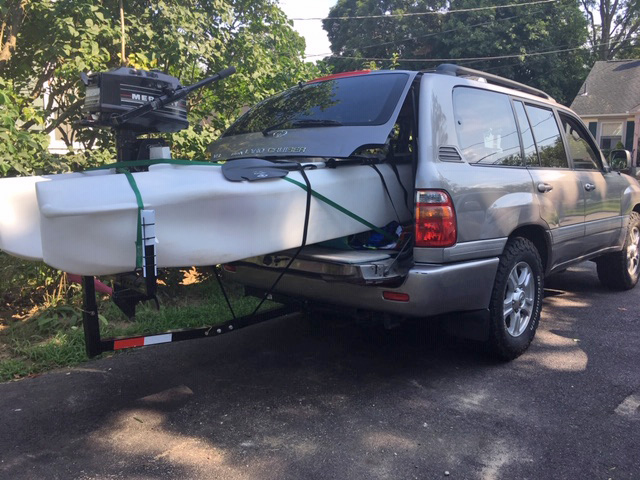 S4 motor kayak transported inside an SUV outfitted with a T-extension