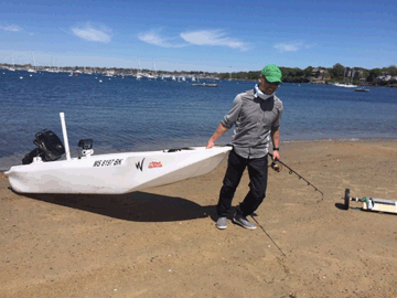 Fisherman drags his S4 motorized kayak up the beach
