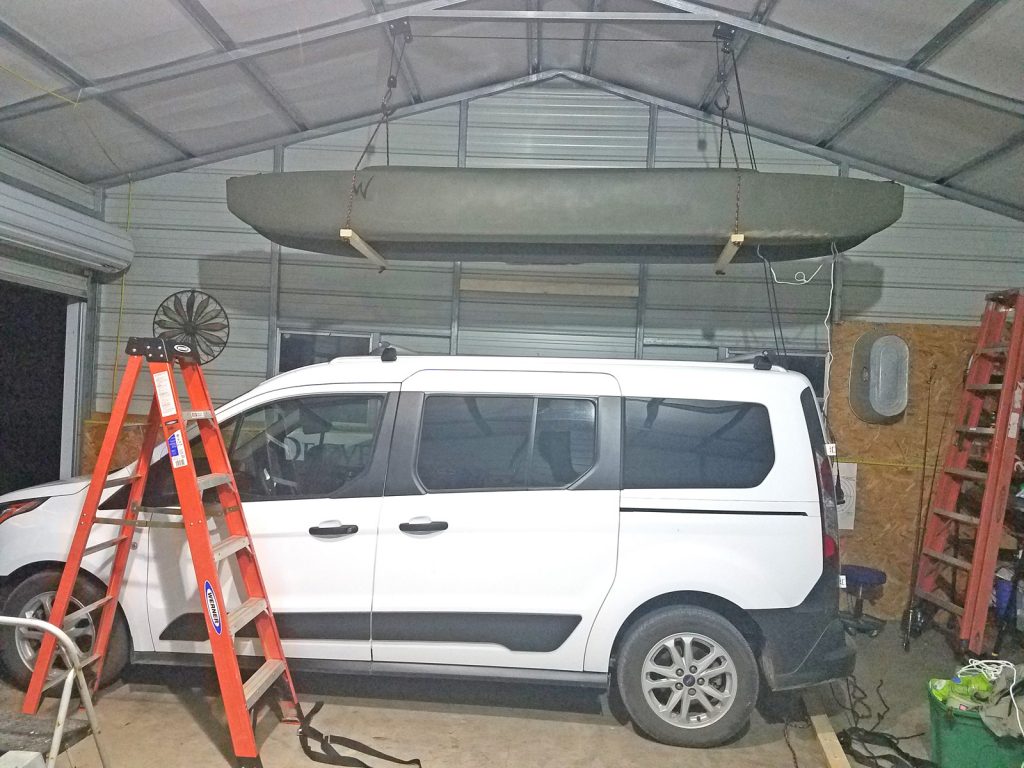 W700 fishing kayak stored in garage