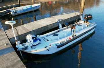 S4 cat microskiff with trolling motor at the bow