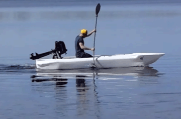 kayaker paddling a motorized kayak
