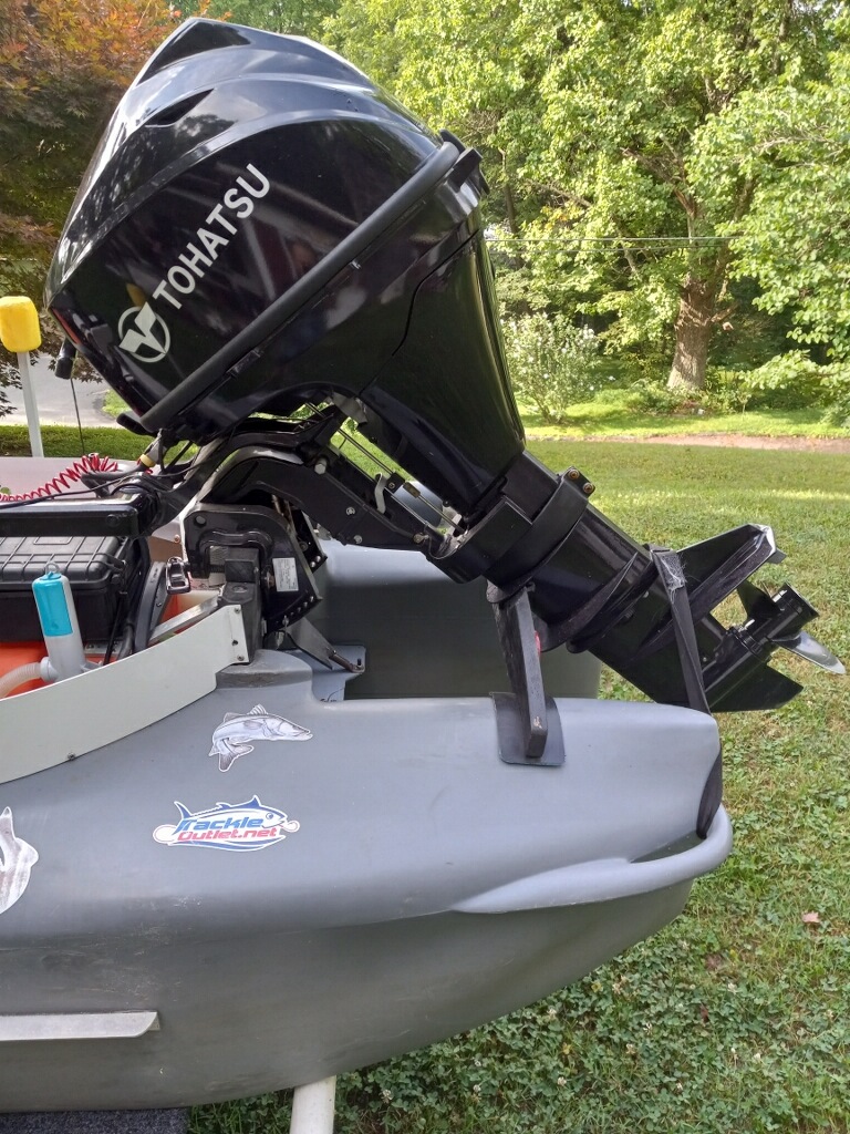 Tohatsu 9.8 HP outboard motpr mounted on Wavewalk S4 microskiff