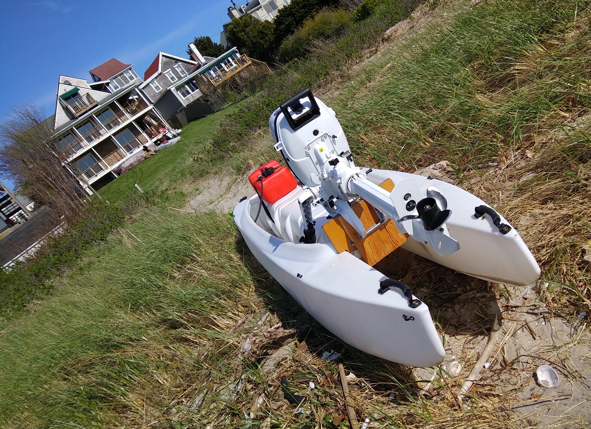Rear view of the W720 Kayak Skiff with a 6 HP Tohatsu outboard motor mounted on a reinforced motor mount