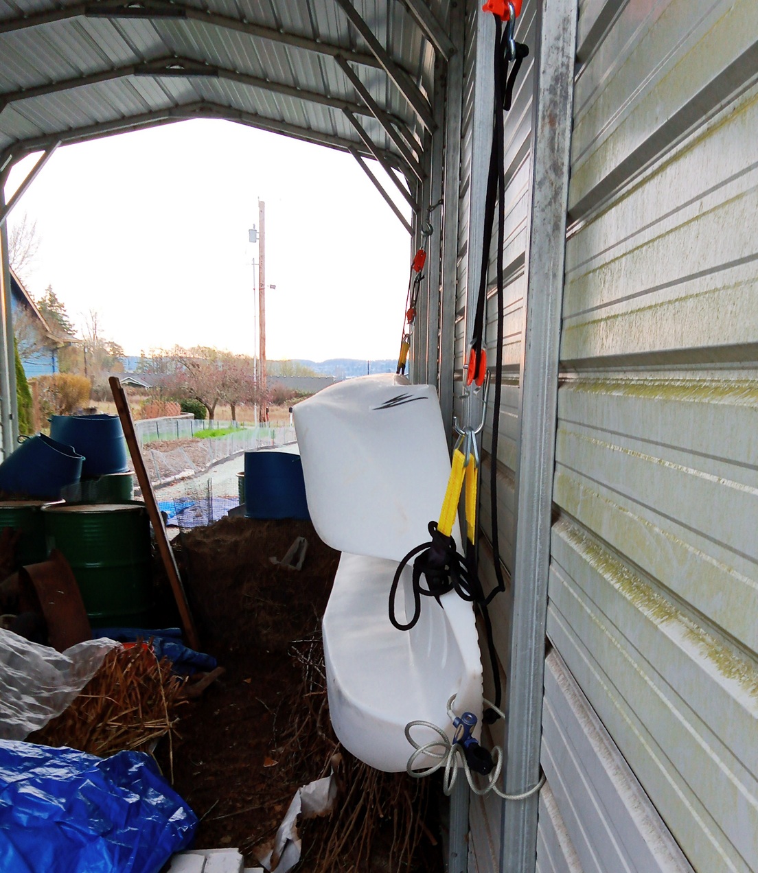 Hanging the boat on its side on the garage wall