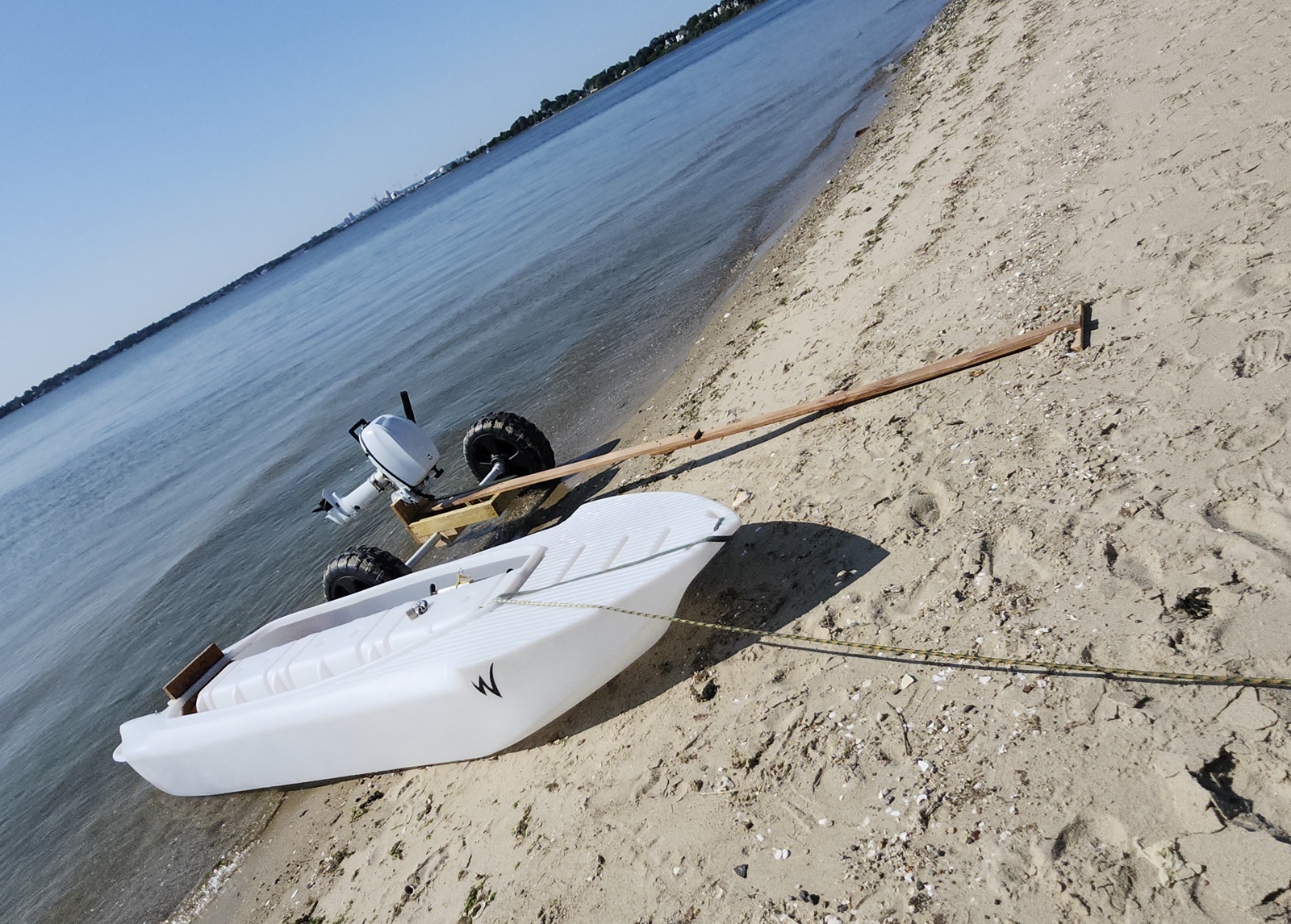 Big Wheel Cart for S4 Microskiff on the way back, beached - Outboard Motor attached to the wheel cart
