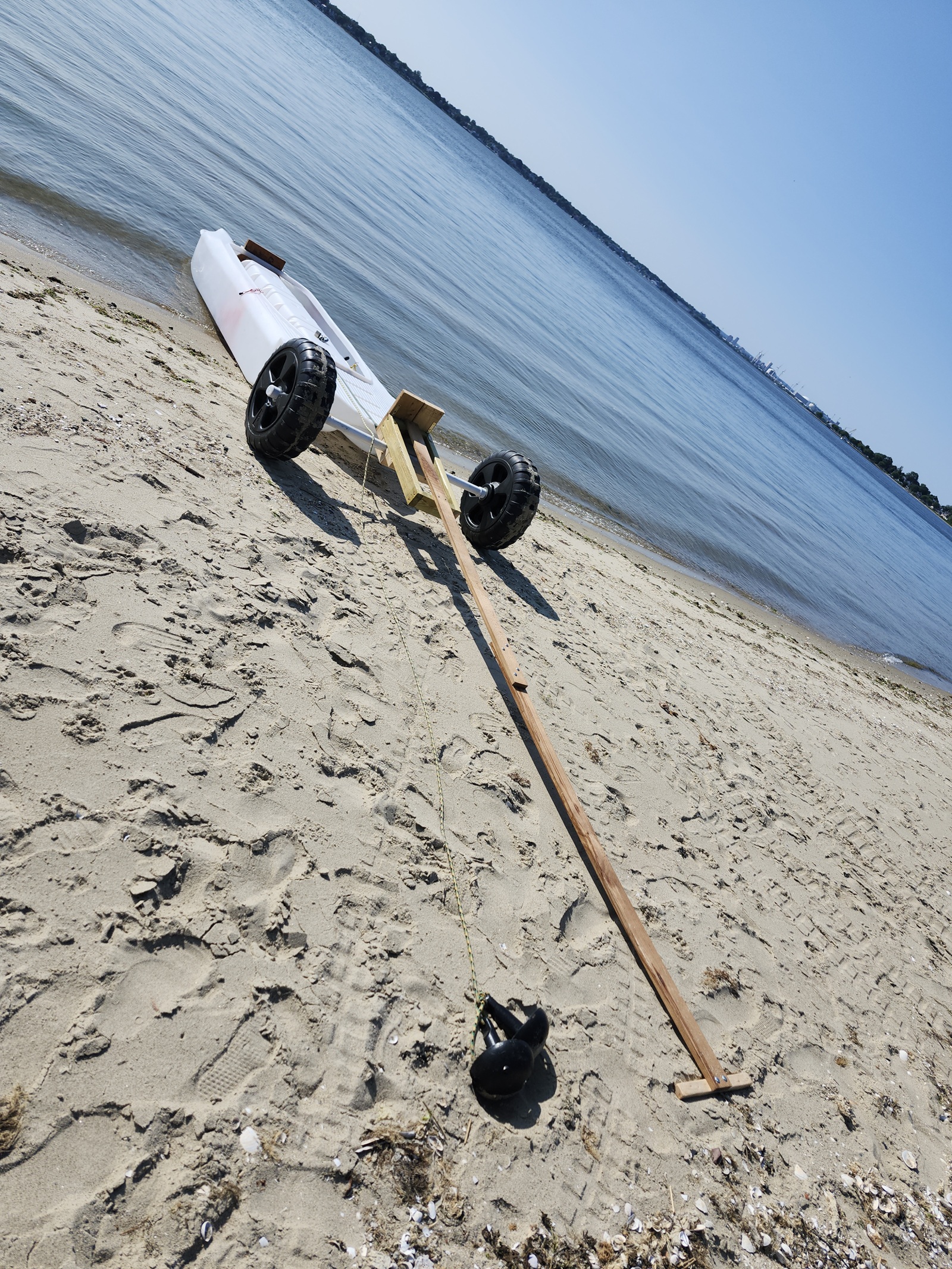 Back from carrying the motor up the beach - Getting ready to upload the boat on the wheel cart